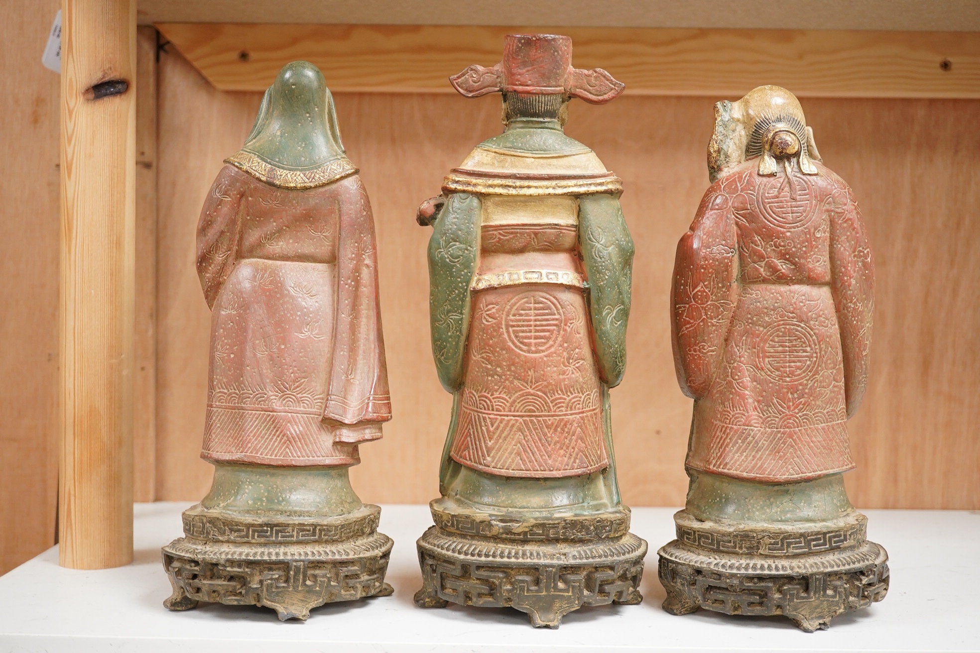 A set of three Chinese polychrome composition figures of the Sanxing (three star gods), tallest 29cm high. Condition - good